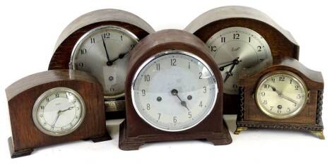 A collection of five mantel clocks and timepieces, to include a brown Bakelite cased piece, a presentation clock engraved To Walter Lee, Chief Surveyor, from Ocean Cole company Limited 1941 etc. Provenance: This timepiece formed part of Luke Jerram's inst