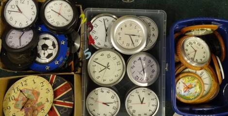 A large quantity of battery operated wall clocks, some with wooden cases, but mainly novelties. (4 boxes) Provenance: This timepiece formed part of Luke Jerram's installation Harrison's Garden, at The Ropewalk Gallery, Barton Upon Humber 2019.