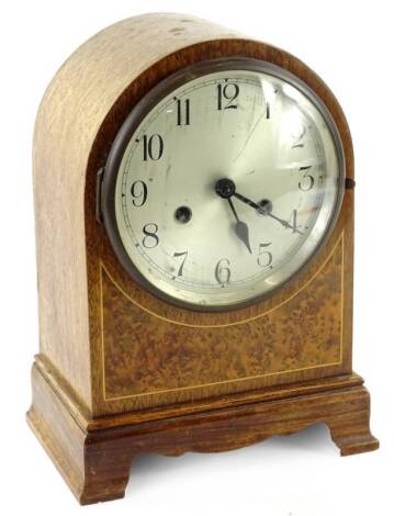 An early 20thC mahogany and burr yew mantel clock, the silvered dial with Roman numerals, 30cm H. Provenance: This timepiece formed part of Luke Jerram's installation Harrison's Garden, at The Ropewalk Gallery, Barton Upon Humber 2019.