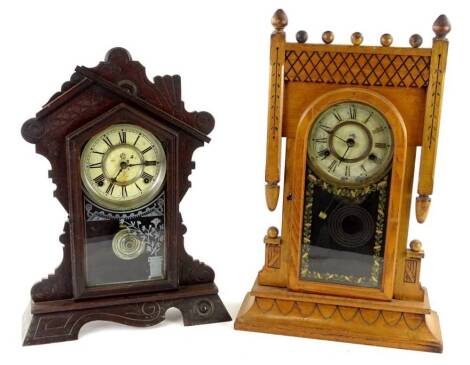 Two American mantel clocks, one with carved ash case, painted dial and verre eglomise embellishment, 58cm H and another similar, 51cm H. Provenance: This timepiece formed part of Luke Jerram's installation Harrison's Garden, at The Ropewalk Gallery, Barto