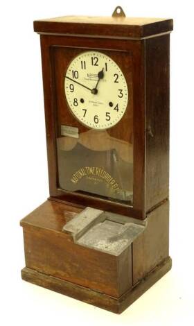 A National Time Recorder Company Ltd clocking in clock, the painted dial stamped St Mary Cray Kent, in an oak case, 83cm H. Provenance: This timepiece formed part of Luke Jerram's installation Harrison's Garden, at The Ropewalk Gallery, Barton Upon Humber