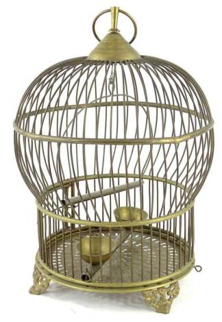 A Continental brass bird cage, with pierced base, scroll cast feet, 30cm H.