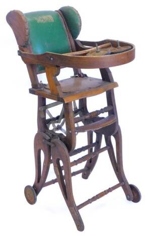 A Victorian ash adjustable child's chair, with green padded back, on castors. (AF)