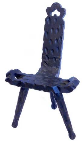 A Continental stained and carved pine spinning chair, of rustic form with pierced back and sides.