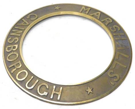 A cast brass traction or steam engine roundel, stamped Marshalls Gainsborough, 55cm dia.