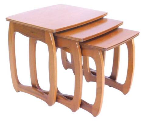 A nest of three retro style teak tables in the manner of 'G' plan, the largest 50cm W.