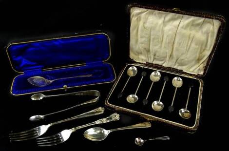 A collection of small silver, to include a set of six berry coffee spoons and other spoons, tongs etc.