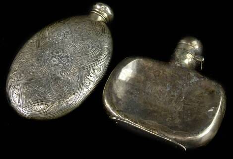 A Victorian silver oval hip flask, decorated with scrolls etc., Birmingham 1860 and another hip flask (AF), 4¼oz.