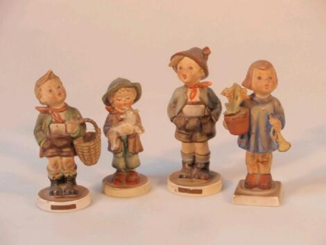 Four Hummel figures: Brother; Boy with Lamb; Village By (repaired) and