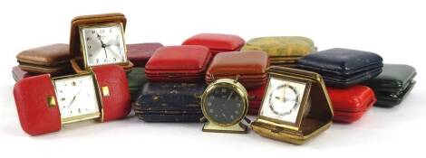 A quantity of leather and other travelling alarm clocks etc.