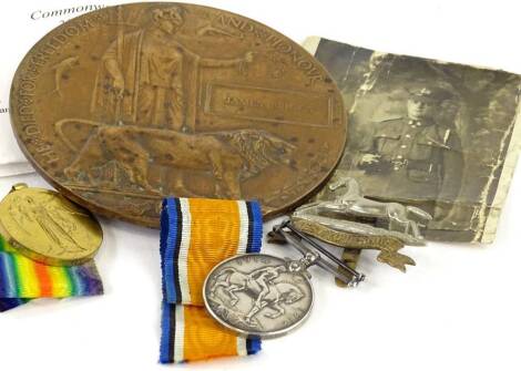 First World War medals and memorabilia, relating to a private J.Briggs 5279 of the Second Batallion of the West Yorkshire Regiment, the 1914-18 medal, The Victory medal, photograph, West Yorkshire regiment cat badge and his death plaque or penny. Provenan