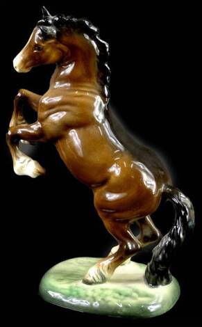 A Beswick brown rearing horse, impressed number 1014, 26cm H.