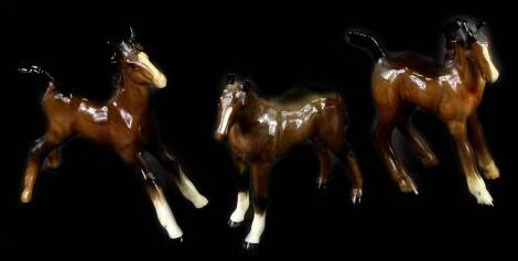 Three Beswick brown foals, the tallest 12cm H.