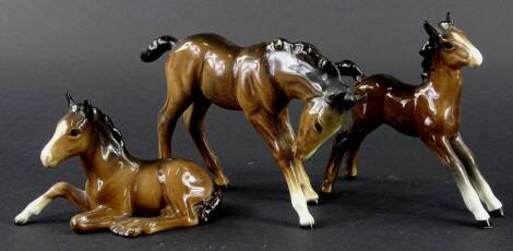 Three Beswick brown foals, the tallest 13cm H. (AF)