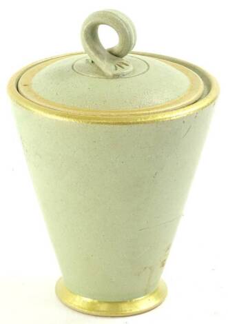 A green glazed studio pottery jar and cover, with gilt borders by Daphne Garritt.