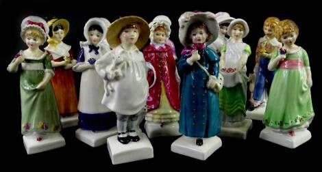 A collection of twelve Royal Doulton Kate Greenaway figurines, each on a square base.