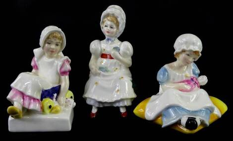 Three Royal Doulton figurines, Ellen, Nell and Cathy.