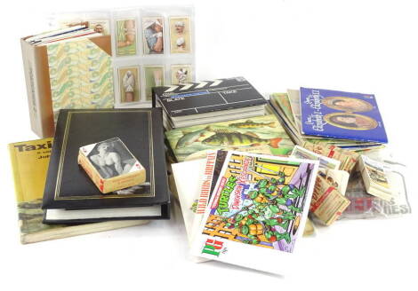 Miscellaneous ephemera etc., to include cigarette cards, modern postcards, book on taxidermy, Happy Families game etc.