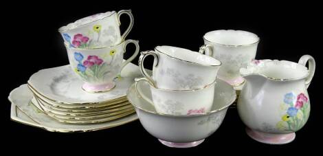 A Shelley part tea service, decorated with Art Deco style flowers, trees etc., pattern number 12812, some pieces (AF)