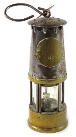 A Protector oil lamp, numbered 1130 and with a Linby Colliery label.