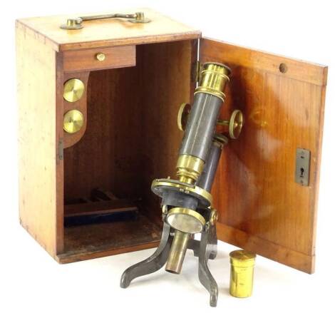 A T and H Doublet brass microscope, with various fittings in a fitted teak case, 17cm H.