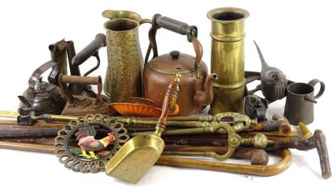 Various items of metalware, to include copper kettle, trenchart vases, various walking sticks, fire irons etc.