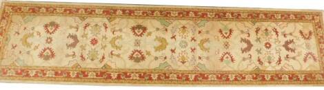 An Afghan Chobi Ziegler style runner, on a beige ground, 370cm x 88cm