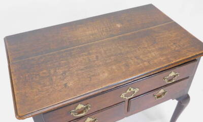 An 18thC oak lowboy, the rectangular top with a moulded edge, above an arrangement of one long and two short drawers, on cabriole legs, with pad feet, 84cm W. - 2