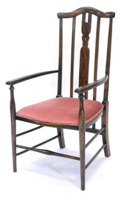 An Edwardian beech boxwood strung and inlaid elbow chair, with a padded seat, on turned tapering legs.