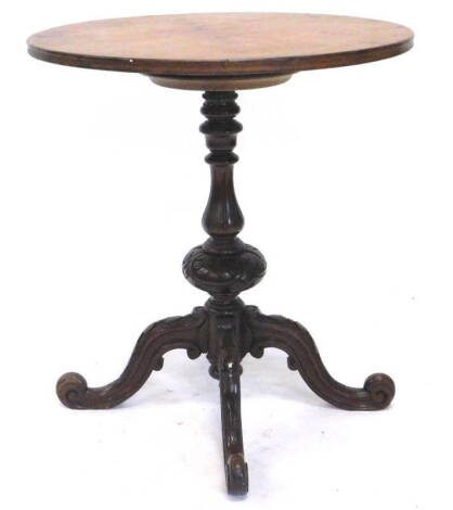 A Victorian walnut occasional table, the associated circular top on a leaf carved turned column and four carved cabriole legs, 91cm dia.