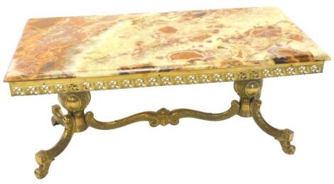 A gilt brass and onyx coffee table, the rectangular top with a moulded edge above a pierced frieze on end supports with cabriole legs, 98cm W.