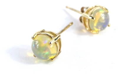 A pair of 9ct gold stud earrings, with oval cut imitation moonstones, with one butterfly back, 0.9g all in.