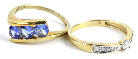 Two 9ct gold dress rings, to include one set with purple/blue stones and another set with CZ stones, 3.6g all in.