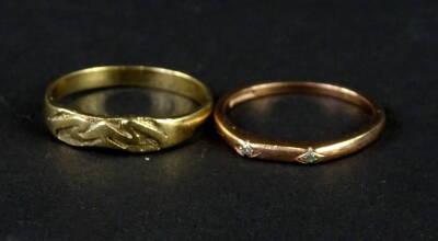 Two 9ct gold dress rings, to include one set with tiny white stones, and another with etched design ring head, 4.1g all in.