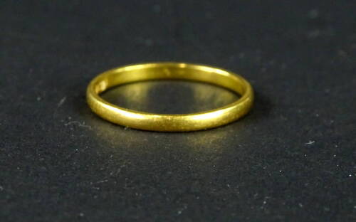 A 22ct gold wedding band, of plain design, ring size P, 2g all in.