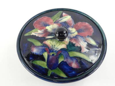 A Moorcroft iris pattern powder bowl and cover, with tube decoration to the lid, impressed marks to lid and to base, 16cm dia. - 2