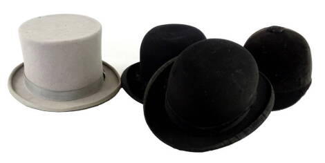 Various gentleman's hats, to include a Young's grey top hat, a Wallace bowler hat another bowler hat stamped Optimus Finish and a riding helmet, stamped Bryant's Grimsby. (4)