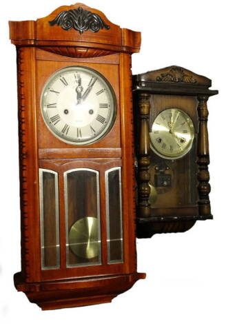 Two wall clocks, to include a 1920's example, refinished in a stained case. Provenance: This timepiece formed part of Luke Jerram's installation Harrison's Garden, at The Ropewalk Gallery, Barton Upon Humber 2019.