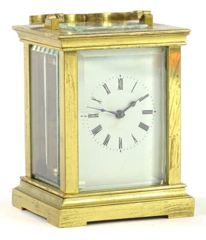 A French small brass carriage timepiece, the white enamel dial with Roman numerals, 9cm H.