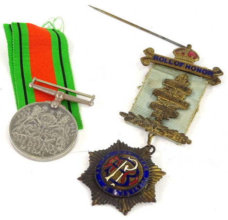 A Masonic jewel, awarded to a Brother Frederick R West of Fitzroy Lodge 6132 and a Second World War Defence medal. (2)