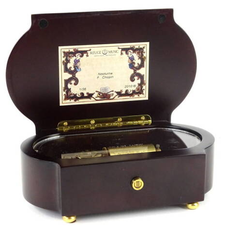 A modern musical box made by Reuge Music, playing Nocturn by Chopin, copyrighted to 2010, in simulated marquetry case, 18cm W.