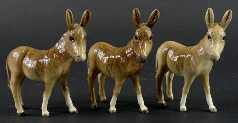 Three Beswick donkey foals, 12cm H.