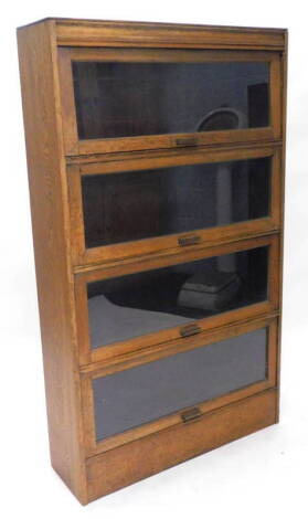 An oak solicitor's type bookcase, with two hinged glazed doors, in the manner of Globe Wernicke, 89cm W.