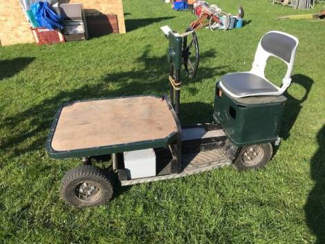 An electric platform yard trolley, with key.