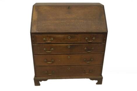 A George III oak bureau, with fall flap resting on lopers, revealing an interior fitted with drawers, cupboards, and pigeon holes and secret compartments, over four graduated cock beaded drawers, with brass swan neck handles and bracket feet, 106cm H, 82c