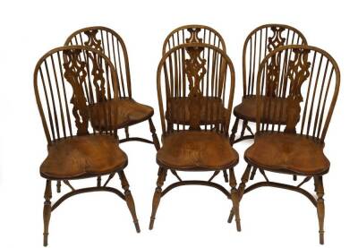 A set of six ash and elm Windsor chairs, with pierced vase and spindle backs moulded saddle seats turned legs and crinoline stretchers.