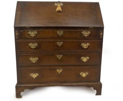 A George III oak bureau, with fall flap resting on lopers, revealing drawers and pigeon holes, over four graduated drawers with brass solid back plate swan neck handles and bracket feet, 104cm H, 92cm W, 48cm D.