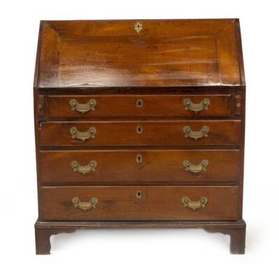 A George III walnut bureau, with fall flap resting on lopers, revealing a fitted interior of pigeon holes, drawers and cupboard, over four moulded and graduated drawers with brass solid back plate loop handles, and bracket feet, 104cm H, 92cm W, 50cm D.