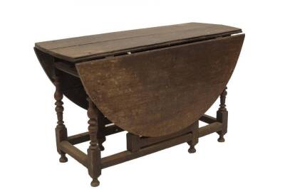 A late 17thC oak gateleg table, with oval drop leaf top, missing drawer, bobbin and baluster turned legs, plain stretchers and turned feet, 75cm H, 123cm L, 153cm W. - 2