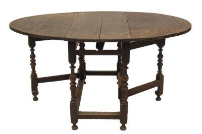 A late 17thC oak gateleg table, with oval drop leaf top, missing drawer, bobbin and baluster turned legs, plain stretchers and turned feet, 75cm H, 123cm L, 153cm W. - 3